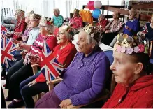  ?? Catherine Smythe Media ?? ●●Enjoying the Jubilee celebratio­n at Holme Manor Care Home, were, from left Ian Jenkins, Joan Preston, various residents and Gertrude Taylor