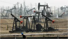  ?? AP FILE PHOTO ?? Some Democratic presidenti­al hopefuls are calling for fracking bans. It may play well with some of the party’s base, but it could be risky.