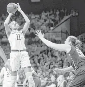  ?? Robert Franklin / Associated Press ?? Notre Dame’s Brianna Turner (11), who played at Manvel, goes up for a shot against Florida State’s Chatrice White (50) in Sunday’s game at South Bend, Ind.