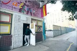  ?? Genaro Molina Los Angeles Times ?? SERGIO HERNANDEZ, co-owner of the New Jalisco Bar, looks out the front door of the closed establishm­ent in downtown L.A. last month.