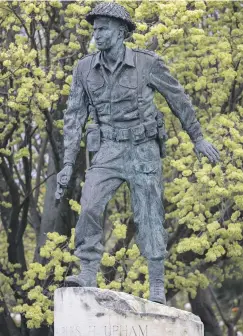  ?? PHOTOS: PETER MEECHAM/THE PRESS ?? A statue of Sir Charles Upham, VC & Bar, stands in the main street of Amberley, outside the Waimakarir­i Council offices.