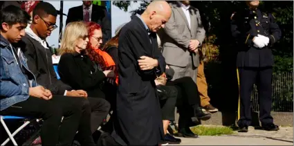  ?? AP PHOTO/MARK LENNIHAN ?? Hugh Hales-Tooke, a friend of victim Nicholas Cleves, kneels during a moment of silence during a ceremony marking the anniversar­y of the Hudson River Park bike path attack, on Wednesday, in New York.