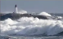  ?? ANDREW VAUGHAN, THE CANADIAN PRESS ?? Waves pound the shore at Peggy’s Cove, N.S., on Friday.