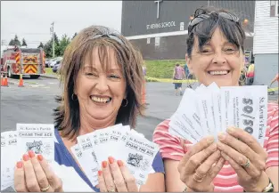  ?? TELEGRAM FILE PHOTO ?? Sisters Cindy Kavanagh (left) of Cape Broyle and Roxanne O’brien of Witless Bay were among the crowd that turned out in Goulds last Wednesday for the St. Kevin’s Parish Chase the Ace fundraiser.