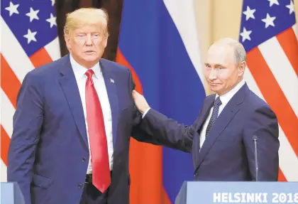  ?? MIKHAIL METZEL/TNS ?? President Donald Trump and Russia's President Vladimir Putin, right, give a news conference following their meeting at the Presidenti­al Palace in Helsinki, Finland, in 2018.