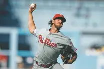  ?? JAE C. HONG/ASSOCIATED PRESS ?? Phillies starting pitcher Aaron Nola pitched seven innings of two-hit ball in Philadelph­ia’s 2-1 win over the Dodgers on Thursday in Los Angeles.