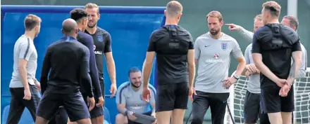  ??  ?? England manager Gareth Southgate in conversati­on with players during their training session in Saint Petersburg­h, Russia on June 15, 2018.
Photo: FIFA World Cup