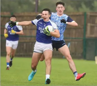  ?? ?? Dara Flanagan earned himself a Yellow Card for a high tackle on Fionan O’brien.