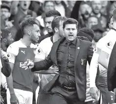  ??  ?? Tottenham manager Mauricio Pochettino reacts as players clash followingT­ottenham’s first goal. — Reuters photo