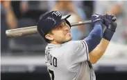  ?? Kathy Willens / Associated Press ?? Rays catcher Travis d’Arnaud watches his threerun homer in the ninth inning, his third of the game.