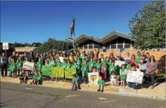  ?? LESLIE KROWCHENKO – DIGITAL FIRST MEDIA ?? Students and parents gathered for a photo outside Glenwood Elementary School Saturday morning as part of #StopETP Day.