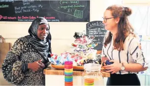  ??  ?? ●●Arc Centre and gallery volunteers Fatima Bah and Rachel Dakin