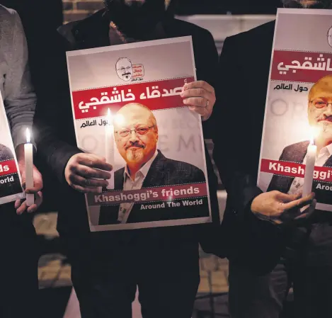  ??  ?? People hold posters picturing Saudi journalist Jamal Khashoggi during a vigil outside the Saudi Consulate in Istanbul, Oct. 25, 2018.