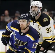  ?? JEFF ROBERSON — THE ASSOCIATED PRESS ?? Bruins defenseman Zdeno Chara, top, and Blues wing Jaden Schwartz will battle one more time tonight with the winner earning the Stanley Cup.