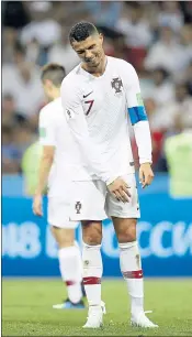  ??  ?? Argentina’s Lionel Messi, right, and Portugal’s Cristiano Ronaldo react Saturday during their round of 16 matches against France and Uruguay — matches the stars’ teams both lost in what could’ve been their final World Cup.