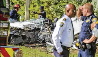  ??  ?? A man was killed and a bystander was nearly hit early Monday morning after a domestic dispute ended with a police chase and crash in south Fulton County. The vehicle flipped over and crashed into a utility pole near Creel Road. The man died as a...