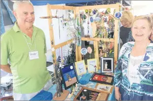  ?? MITCH MACDONALD/THE GUARDIAN ?? Little Harbour artisan Rita MacDonald, right, and husband Malcolm show some of their products at the ninth annual Mermaid Tears Sea Glass Festival held recently at the Souris Lighthouse grounds.
