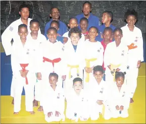  ?? (Pic: Melusi Mkhabela) ?? Some of the judokas team members who will be going to Turkiye posing for a group picture yesterday afternoon at the Theatre Club in Mbabane.