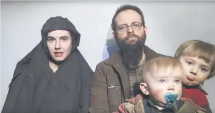  ?? Taliban Media via The Associated Press ?? Caitlan Coleman of Pennsylvan­ia talks while her Canadian husband, Joshua Boyle, holds two of their children in this image from a Taliban video from 2016.