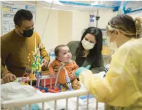  ?? BRIAN CASSELLA/CHICAGO TRIBUNE ?? Fernando and Margarita Ruiz visit their 15-month-old son, Ricky, in February at La Rabida Children’s Hospital in Chicago. Ricky, who was born prematurel­y and has a trach and ventilator, had been unable to go home without pediatric nursing care.