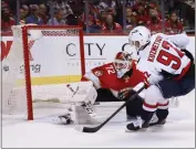  ?? REINHOLD MATAY — THE ASSOCIATED PRESS ?? Washington center Evgeny Kuznetsov scores on Florida goaltender Sergei Bobrovsky in the third period of Game 1.