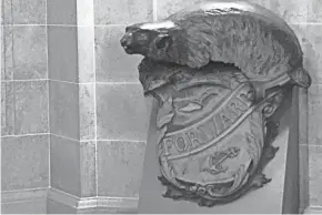  ?? TODD RICHMOND, ASSOCIATED PRESS ?? A Badger and Shield statue is seen outside the governor's Capitol office in Madison last week. On loan for more than 30 years, the U.S. Naval Academy wants the State of Wisconsin to return the statue. The Navy wants to include it in an exhibit featuring the USS Wisconsin battleship in Norfolk, Va. State historians are fighting to keep the statue in the state for another two years.