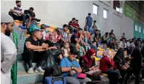  ?? AFP ?? Palestinia­ns wait to travel to egypt through the Rafah border crossing in the southern Gaza Strip. —