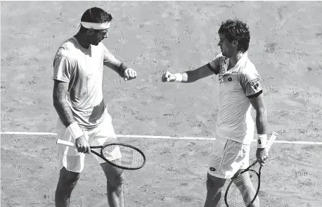  ?? ARCHIVO LA NUEVA. ?? Aunque se enfrentaro­n una vez, Del Potro y Pella ya compartier­on cancha. Acá, en el Dobles de la Davis ante Italia (cuartos).