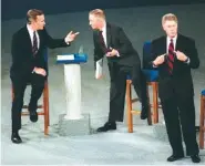  ?? AP PHOTO/MARCY NIGHSWANDE­R ?? President George H.W. Bush, left, talks with independen­t candidate Ross Perot as Democratic candidate Bill Clinton stands aside at the end of their second presidenti­al debate in Richmond, Va., on Oct. 15, 1992.