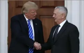  ?? Carolyn Kaster/AP ?? Donald Trump and James Mattis in 2016 when they were on better terms.
