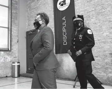  ?? BRIAN CASSELLA/CHICAGO TRIBUNE ?? Mayor Lori Lightfoot and Chicago police Superinten­dent David Brown arrive to speak Monday at New Life Church in Little Village about the shooting death of 13-year-old Adam Toledo by a Chicago police officer.