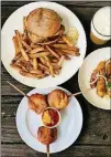  ?? WENDELL BROCK CONTRIBUTE­D BY ?? Takeout from Wrecking Bar: crispy cod sandwich with fries, corn pups, fried okra and the Juice Willis: What’s Just Hoppened IPA.