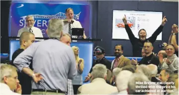  ??  ?? Mike Brewer was clearly thrilled with the price his car achieved at auction.