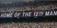  ?? BOB LEVEY / ASSOCIATED PRESS 2015 ?? Texas A&M fans — known as the “12th Man” — cheer on their team. College football games will especially suffer without fans, who play a major role.