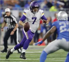  ?? PAUL SANCYA, THE ASSOCIATED PRESS ?? QB Case Keenum scrambles Thursday against the Lions. Minnesota won, 30-23.