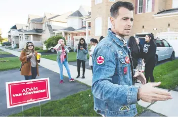  ?? PETER J THOMPSON / NATIONAL POST ?? Liberal party candidate Adam van Koeverden, a four-time Olympic medallist, canvasses in Milton, Ont.