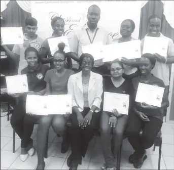  ??  ?? Jennifer Flatts (seated centre) with a batch of class of Elegance trainees