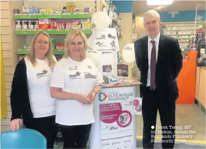  ??  ?? Derek Twigg, MP for Halton, visited the Rowlands Pharmacy Farnworth Street