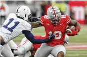  ?? JAY LAPRETE / AP ?? Chip Trayanum (right) was the Buckeyes’ second-leading rusher this season with 373 yards and three touchdowns. He also caught nine passes for 53 yards.