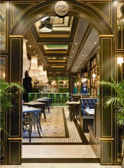  ??  ?? THIS PAGE
Like the other Violet Oon restaurant­s, National Kitchen by Violet Oon features recurring elements such as the emerald counters, black trimmings and Peranakan-style details
