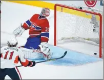  ?? RYAN REMIORZ/THE CANADIAN PRESS VIA AP ?? Ottawa defenseman Erik Karlsson (11) scores a goal against Canadiens goalie Carey Price during their game Thursday.