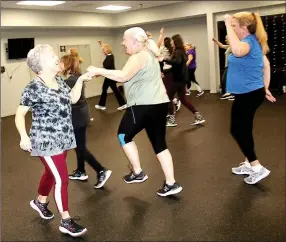  ?? Lynn Atkins/Special to The Weekly Vista ?? Zumba teacher Dina Lombardo (left) makes her classes fun with a variety of music and custom choregraph­y.