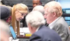  ?? ?? Defense attorney Margaret Fox speaks with her colleagues Wednesday during Alex Murdaugh’s trial for murder at the Colleton County Courthouse in Walterboro, S.C. The 54-year-old attorney is standing trial on two counts of murder in the shootings of his wife and son at their Colleton County, S.C., home and hunting lodge on June 7, 2021. (Joshua Boucher/The State via AP, Pool)