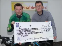  ??  ?? At Enable Ireland Tralee’s HQ last Thursday Tommy Sheehy presented Sean Scally of Enable Ireland with a cheque for €10,870.