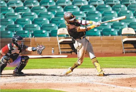  ?? K.C. ALFRED U-T ?? Fernando Tatis Jr. hits a grand slam against the D-backs that travels an estimated 441 feet onto the grassy hill beyond the wall in left.