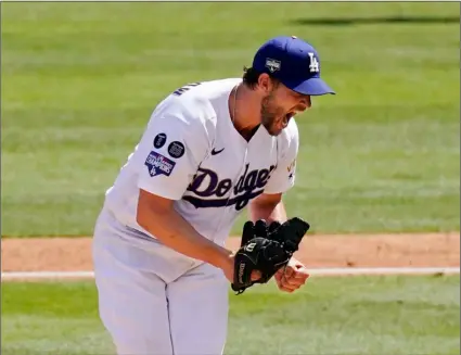  ?? AP Photo/Mark J. Terrill ?? Los Angeles Dodgers starting pitcher Clayton Kershaw celebrates after striking out Washington Nationals’ Jordy Mercer to end the top of the sixth inning of a baseball game on Sunday in Los Angeles.