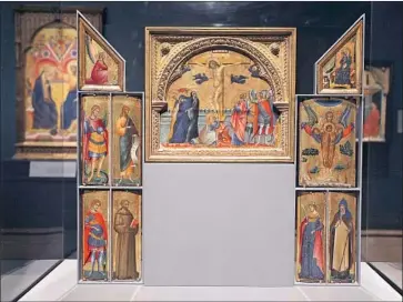  ?? Photograph­s by Gary Coronado Los Angeles Times ?? FORENSICS:
A reassemble­d altarpiece, “The Crucifixio­n, the Annunciati­on and Seven Saints,” lacks a panel.