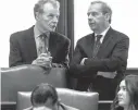  ?? Associated Press ?? House Speaker Michael Madigan, D-Chicago, left, and Senate President John Cullerton, D-Chicago, talk Tuesday on the Senate floor at the Capitol in Springfiel­d, Ill. The Illinois Senate has OK’d an annual spending plan of $36 billion following a...