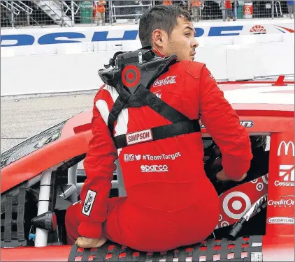  ?? AP PHOTO ?? Driver Kyle Larson climbs out of his #42 car after qualifying for the Overton 301 auto race at the New Hampshire Motor Speedway in Loudon, N.H., on July 14.