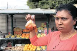  ?? PICTURE: BONGANI MBATHA ?? Joanne Kisten stands in front of her stall, holding her pickles and fried nuts.